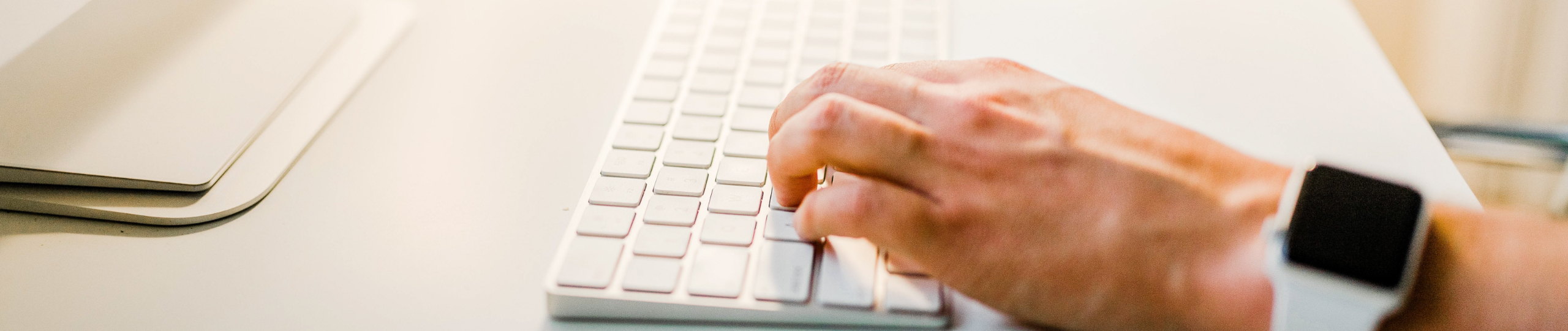 Login Top Banner - Hands Typing on keyboard